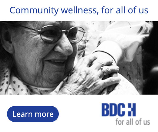 Beaver Dam Community Hospital print ad of elderly woman grasping a hand that has been placed on her shoulder; Community wellness, for all of us