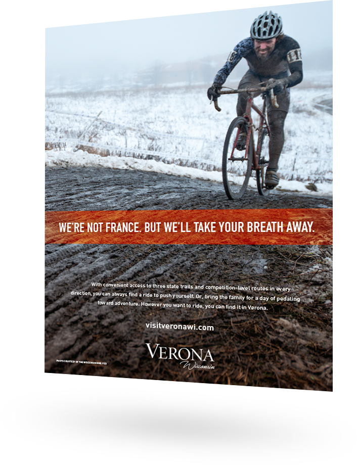 City of Verona ad featuring a bike rider in the winter: We're not France. But we'll take your breath away.