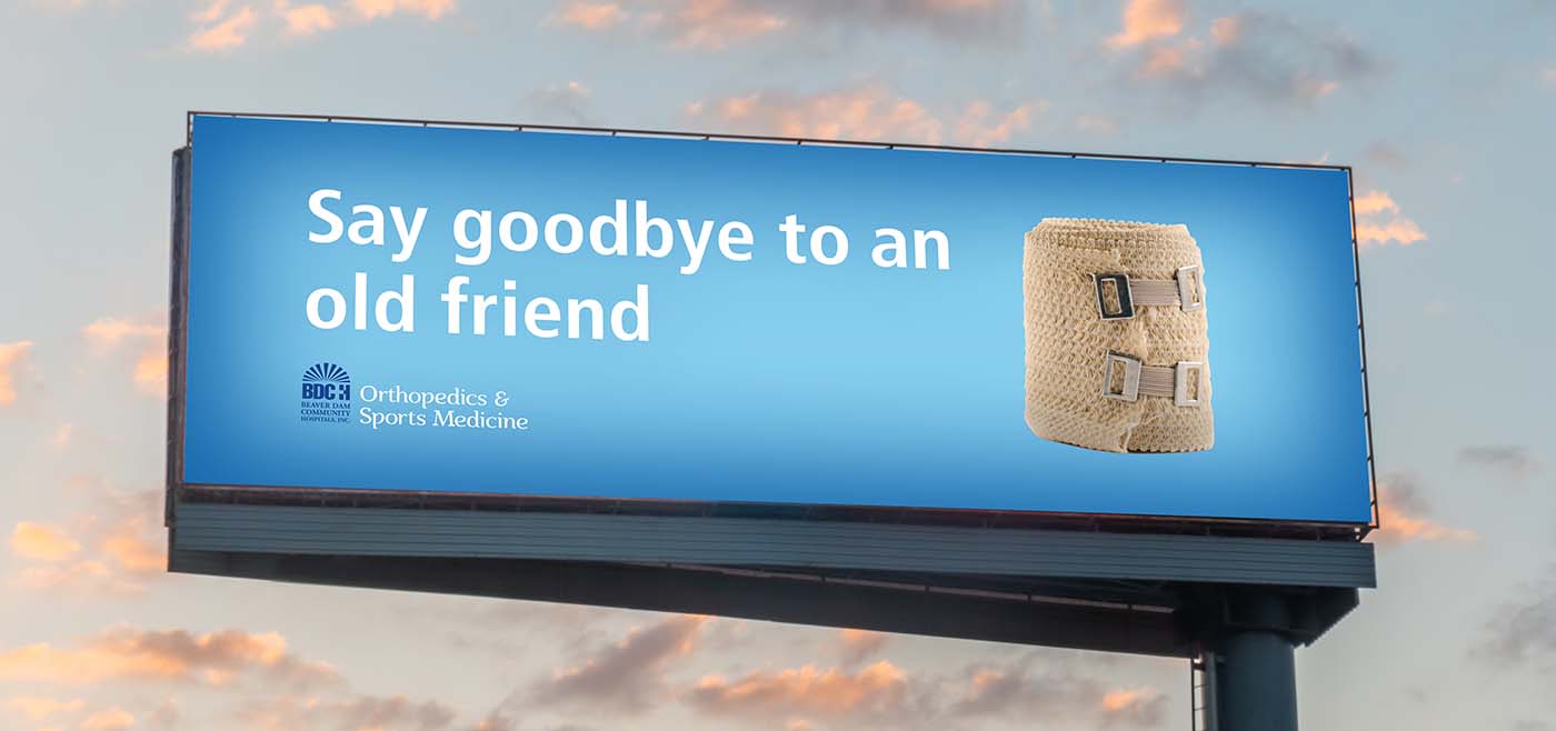 Beaver Dam Community Hospital orthopedics billboard ad: Say goodbye to an old friend. Image of a bandage