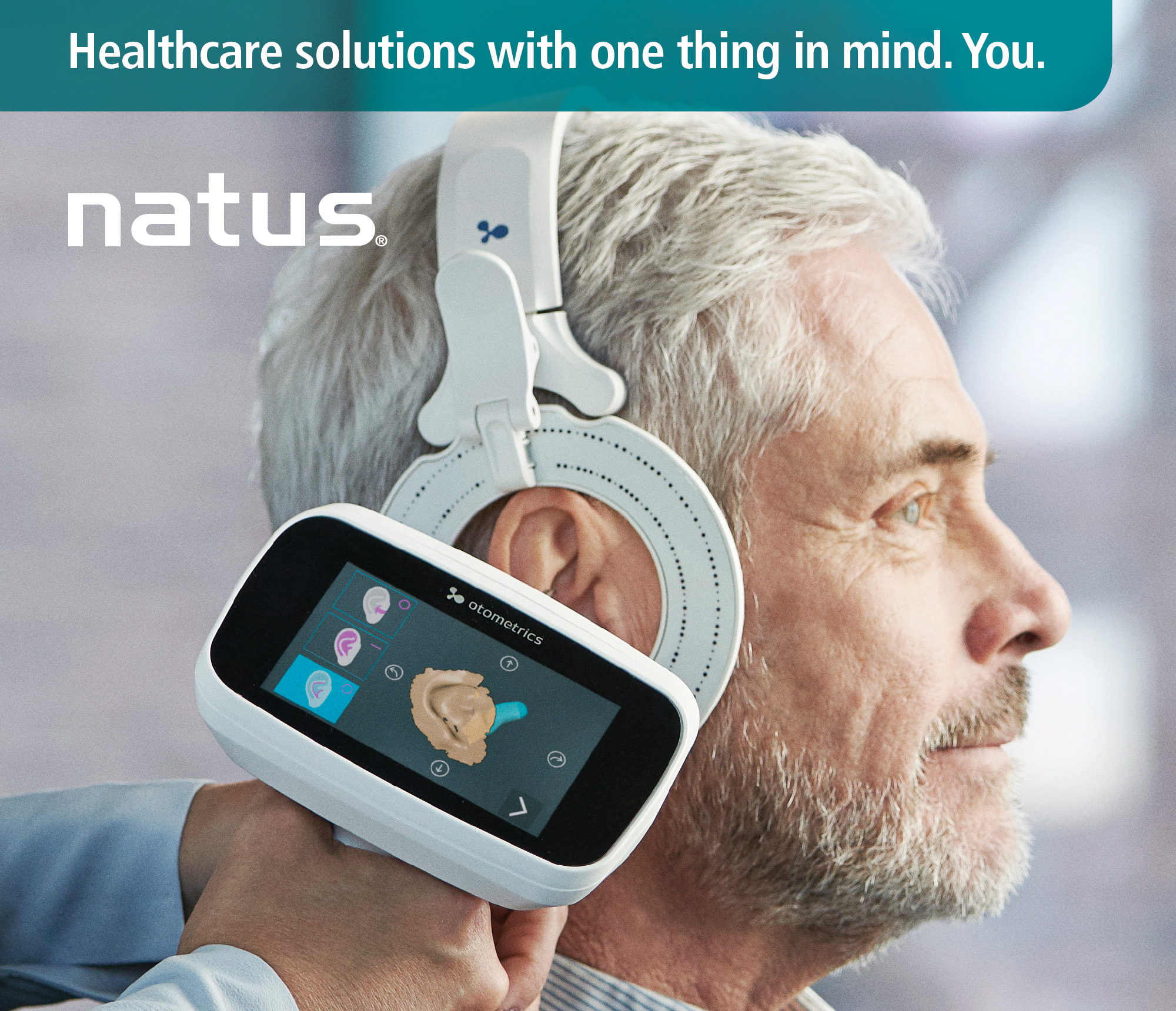 Man having his ear examined by Natus' Otometrics technology