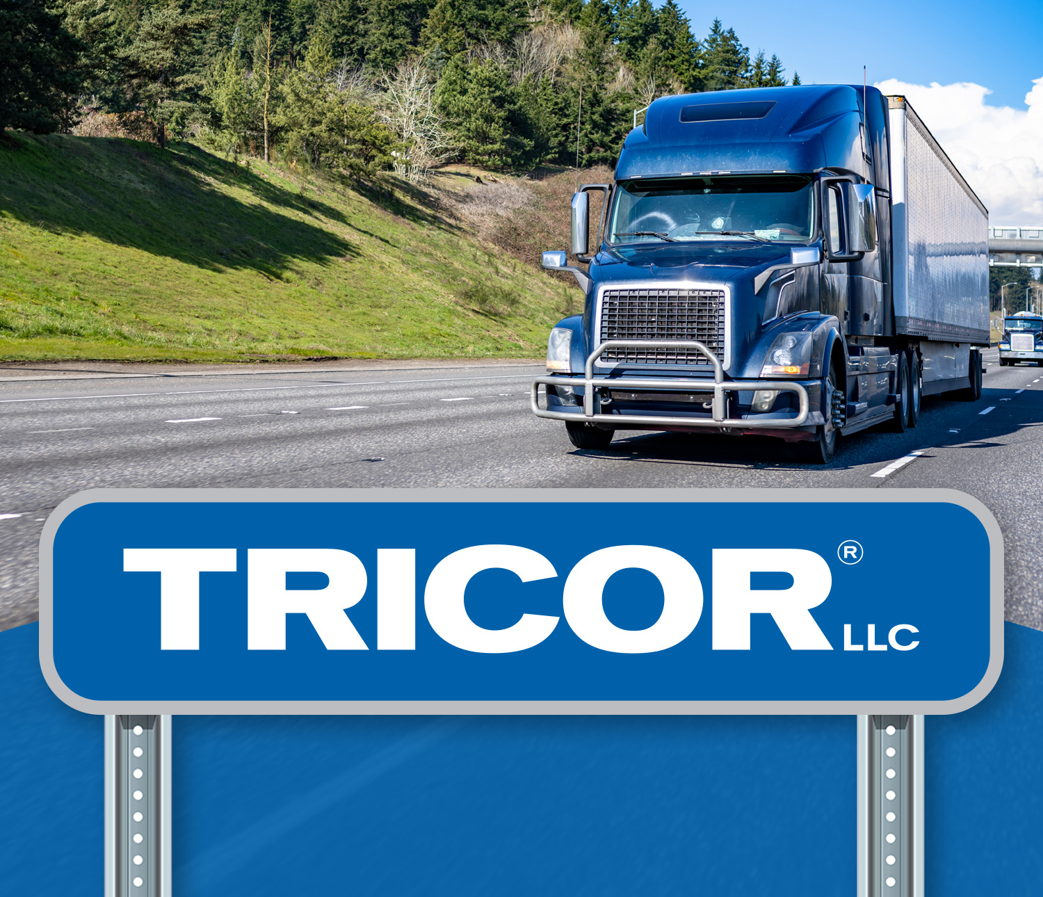 TRICOR logo on a road sign in front of a semi