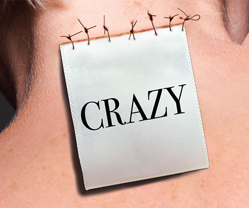 label saying crazy attached to the back of a woman's neck