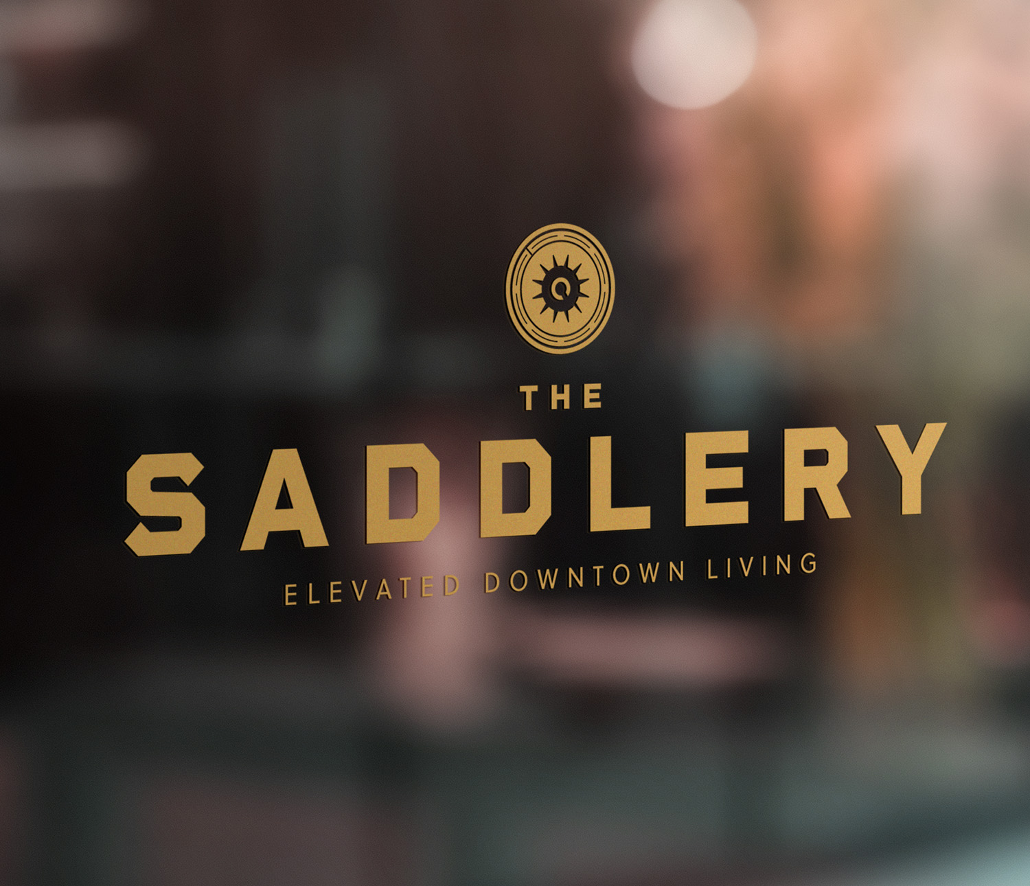On a glass door reads The Saddlery, Elevated Downtown Living