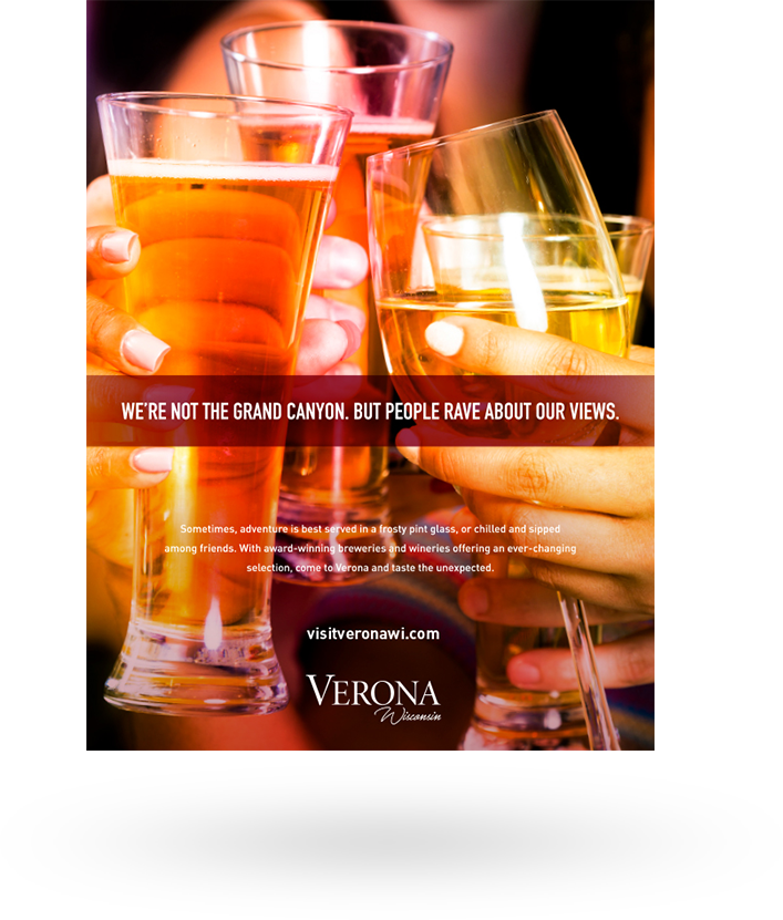 City of Verona ad featuring four glasses toasting: We're not the grand canyon. But people rave about our views.