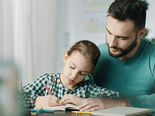 father home schooling his daughter