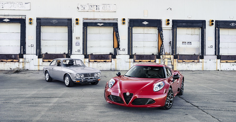 gray and red Alpha Romeo cars in front of an industrial building — ecommerce website